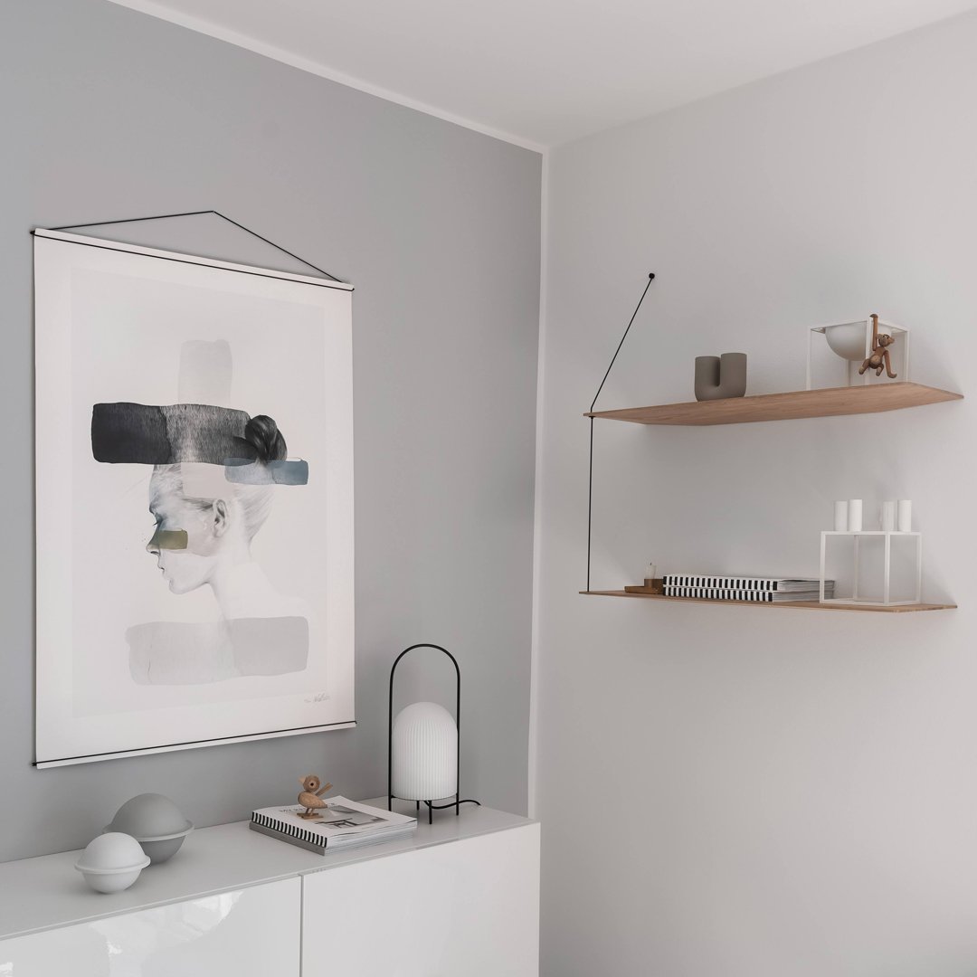 Abstract wall art featuring black, soft gray, and white hues with minimalist design, complementing a modern interior.