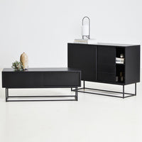 Sleek black furniture set featuring smooth surfaces and minimalist design, accented by bold metal frames and subtle textures.