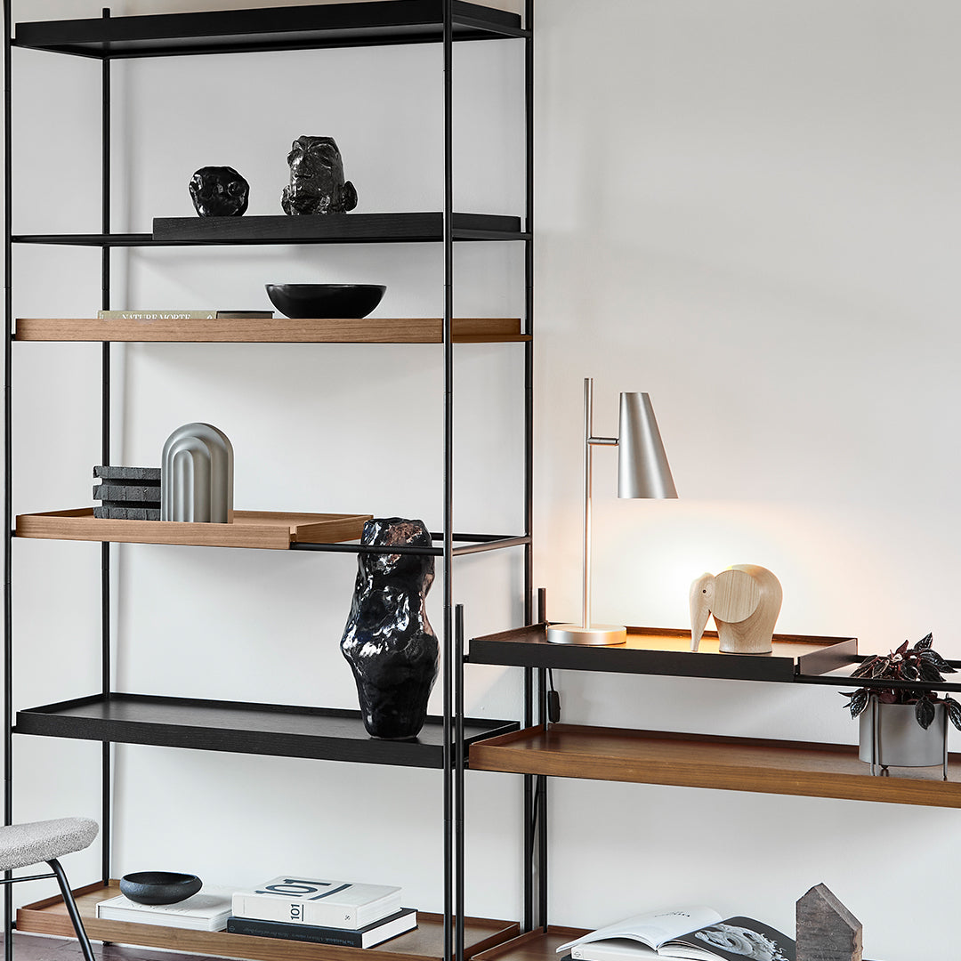 Stylish black metal and wood shelving unit featuring clean lines and minimalistic design. Perfect for modern decor.