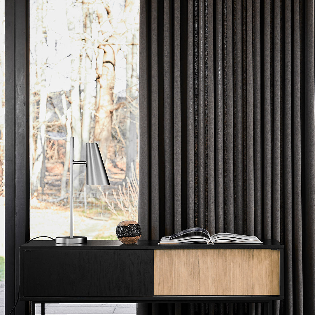 Sleek black and natural wood console table with textured vertical lines and a minimalist design. Perfect for modern spaces.