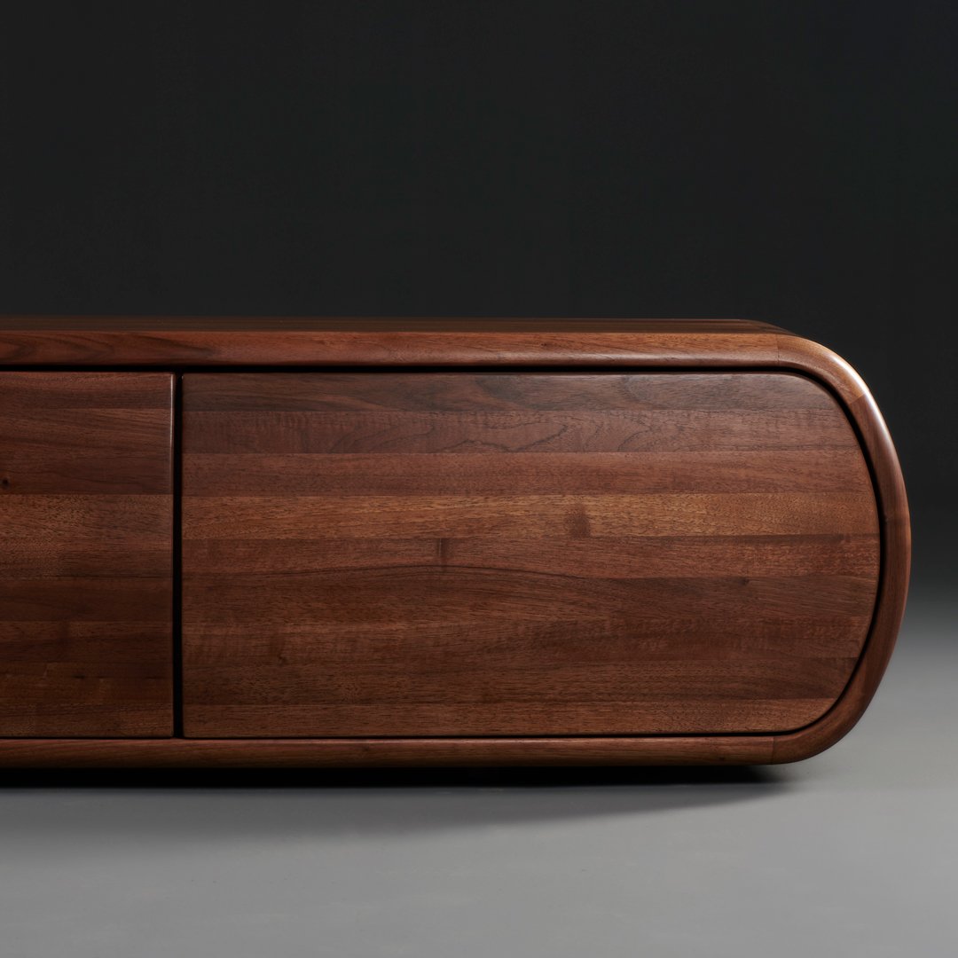 Warm walnut wood with smooth, rounded edges and subtle grain patterns, creating an elegant, modern aesthetic.