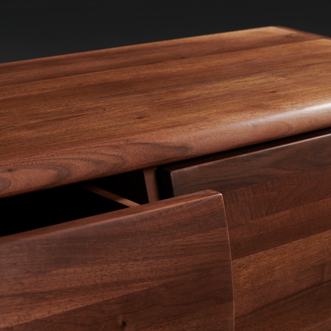 Rich walnut wood finish with smooth grain and warm brown tones, highlighting natural texture and elegant design.