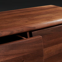 Rich walnut wood finish with smooth grain and warm brown tones, highlighting natural texture and elegant design.