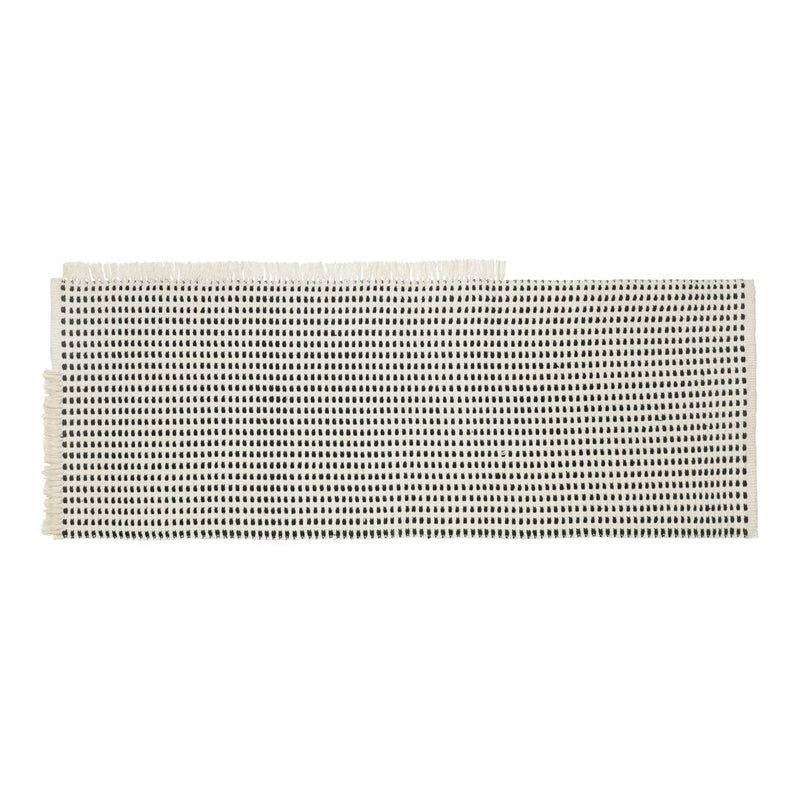 Light beige fabric with a grid pattern of small black dots, ideal for various crafting projects.