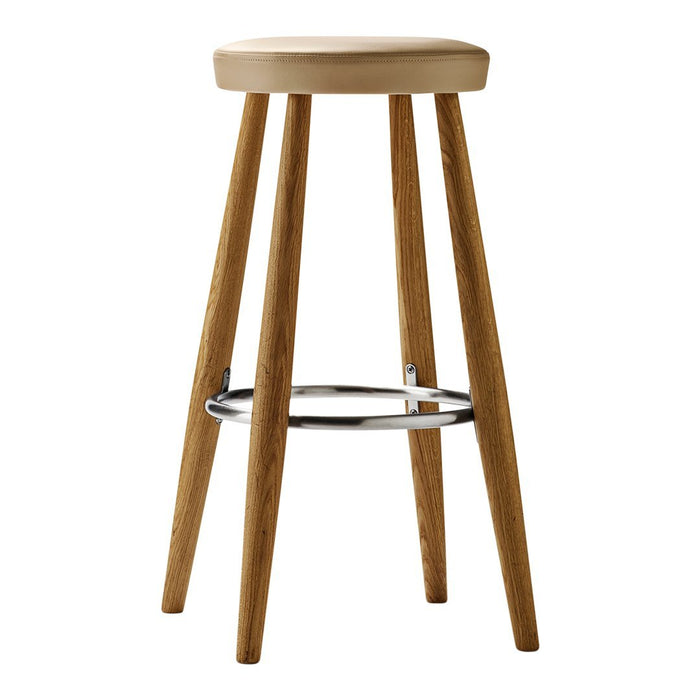 Natural wood bar stool with smooth beige seat and sleek chrome footrest, featuring a minimalistic design.
