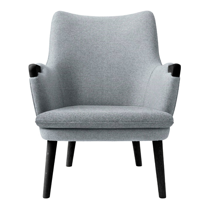 Gray upholstered armchair with sleek, minimalist design and black wooden legs. Soft texture enhances modern aesthetics.