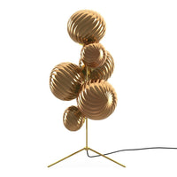 Sleek gold and bronze lamp design featuring textured, swirling patterns on spherical shades.
