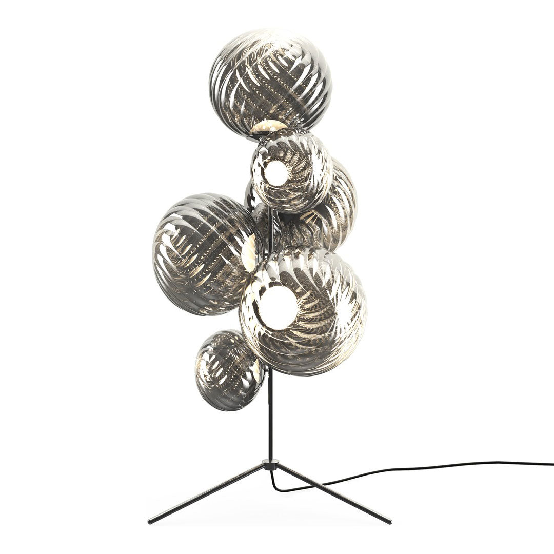 "Modern floor lamp with metallic spheres in shiny silver and black, featuring a stylish spiral pattern."