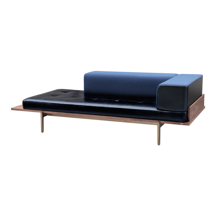 Modern sofa with a sleek black base and blue accent cushions, featuring clean lines and contemporary design.