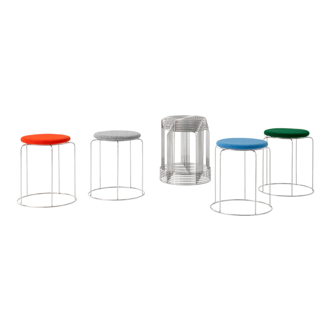 Colorful stools featuring red, blue, green, and gray seats with sleek wire frames, showcasing modern, minimalist design.