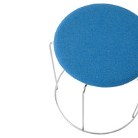 Round blue upholstered stool with a sleek silver base, ideal for modern decor.