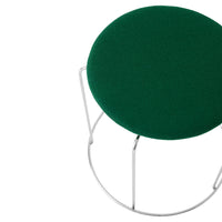 Green circular cushion with a textured surface, set on a sleek metal frame. Ideal for modern decor.