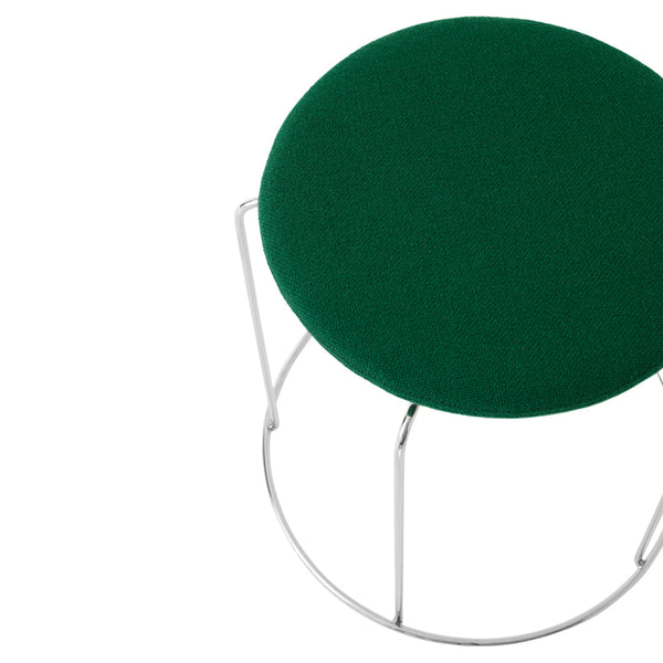 Green round stool with a soft, textured fabric and sleek silver metal legs, perfect for modern decor.