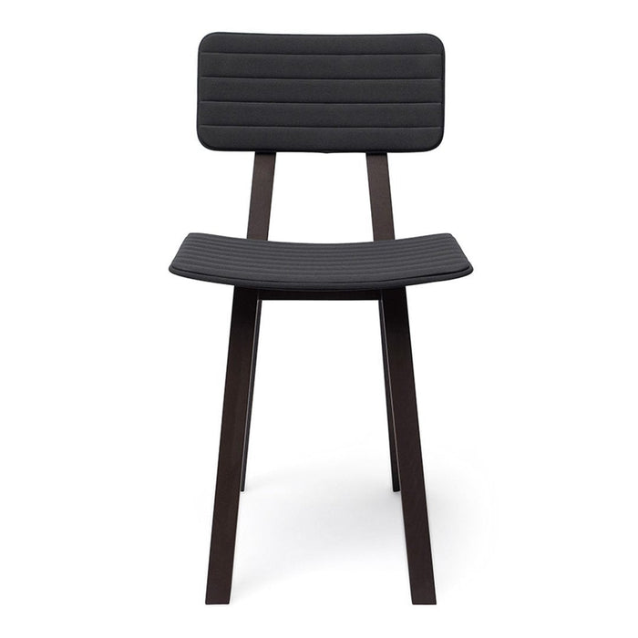 Black upholstered chair with ribbed pattern and dark wooden legs for a modern, minimalist look.