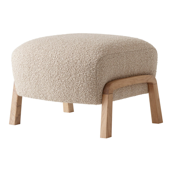 Beige textured ottoman with a cozy, soft surface and natural wooden legs, adding warmth to any decor.