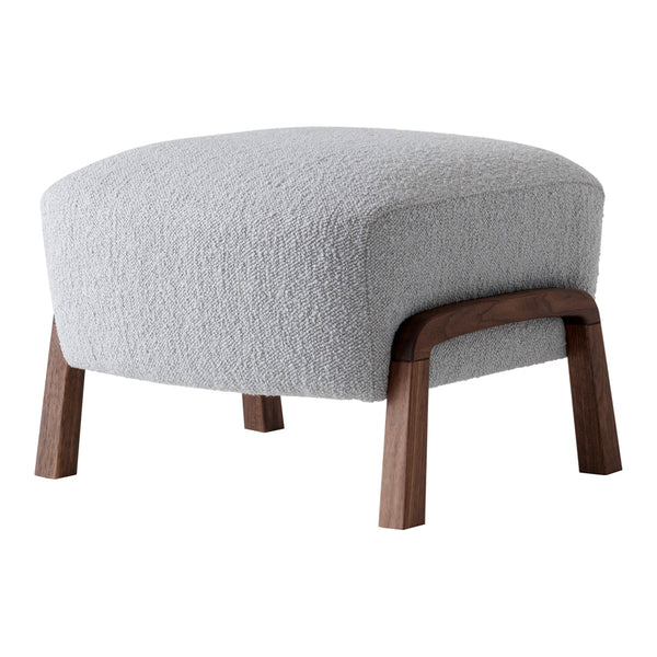 Light gray upholstered ottoman with textured fabric and wooden legs, featuring a modern, minimalist design.