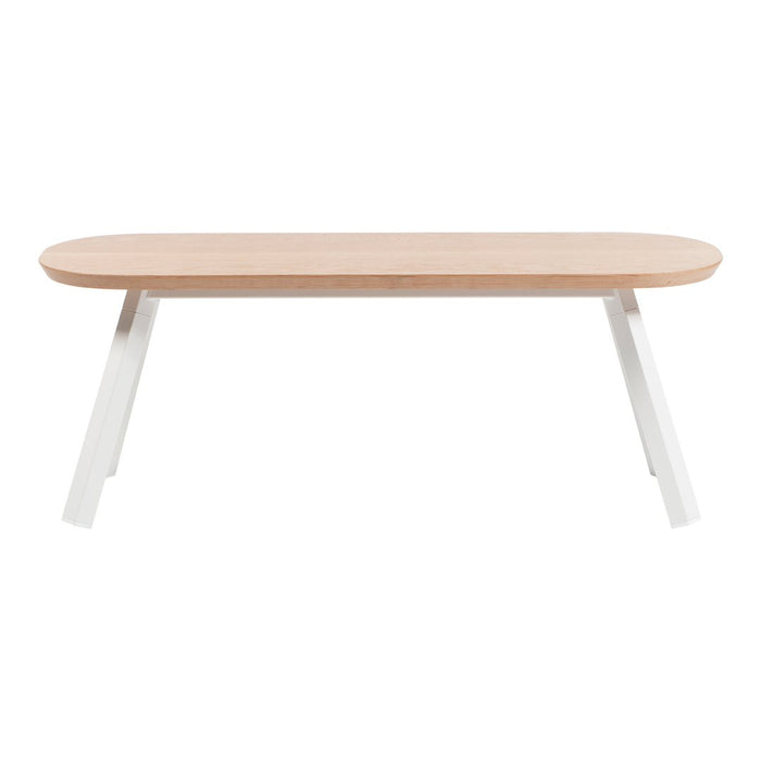 Light wood table with a natural finish and sleek white angular legs, perfect for modern decor.