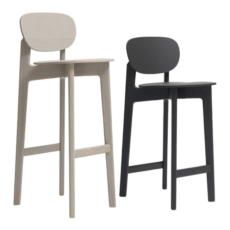 Set of two modern bar stools in light gray and black, featuring sleek, minimalist design and smooth, solid surfaces.