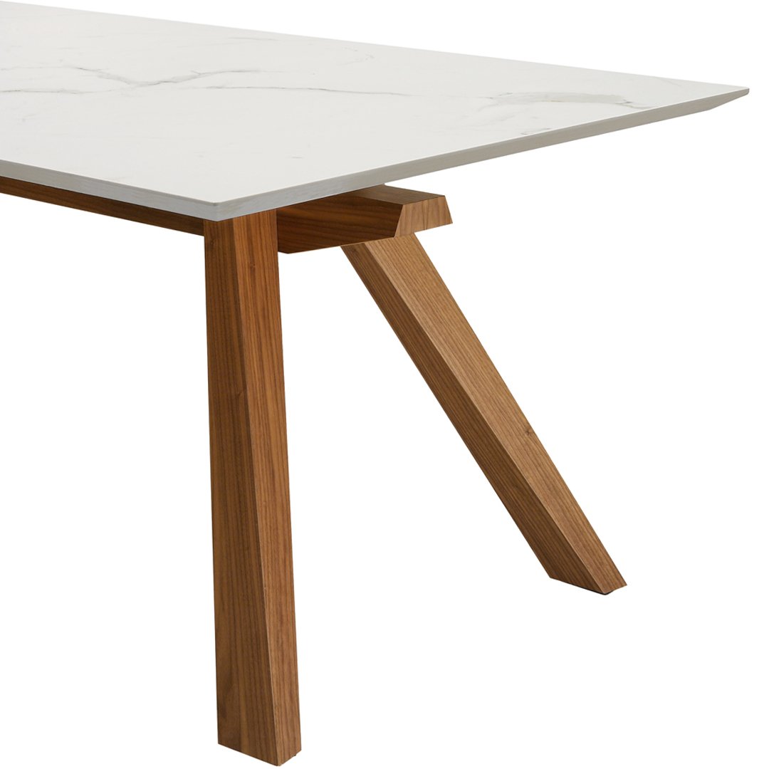 "White tabletop with subtle marbling and natural wood legs, showcasing a modern and sleek design."