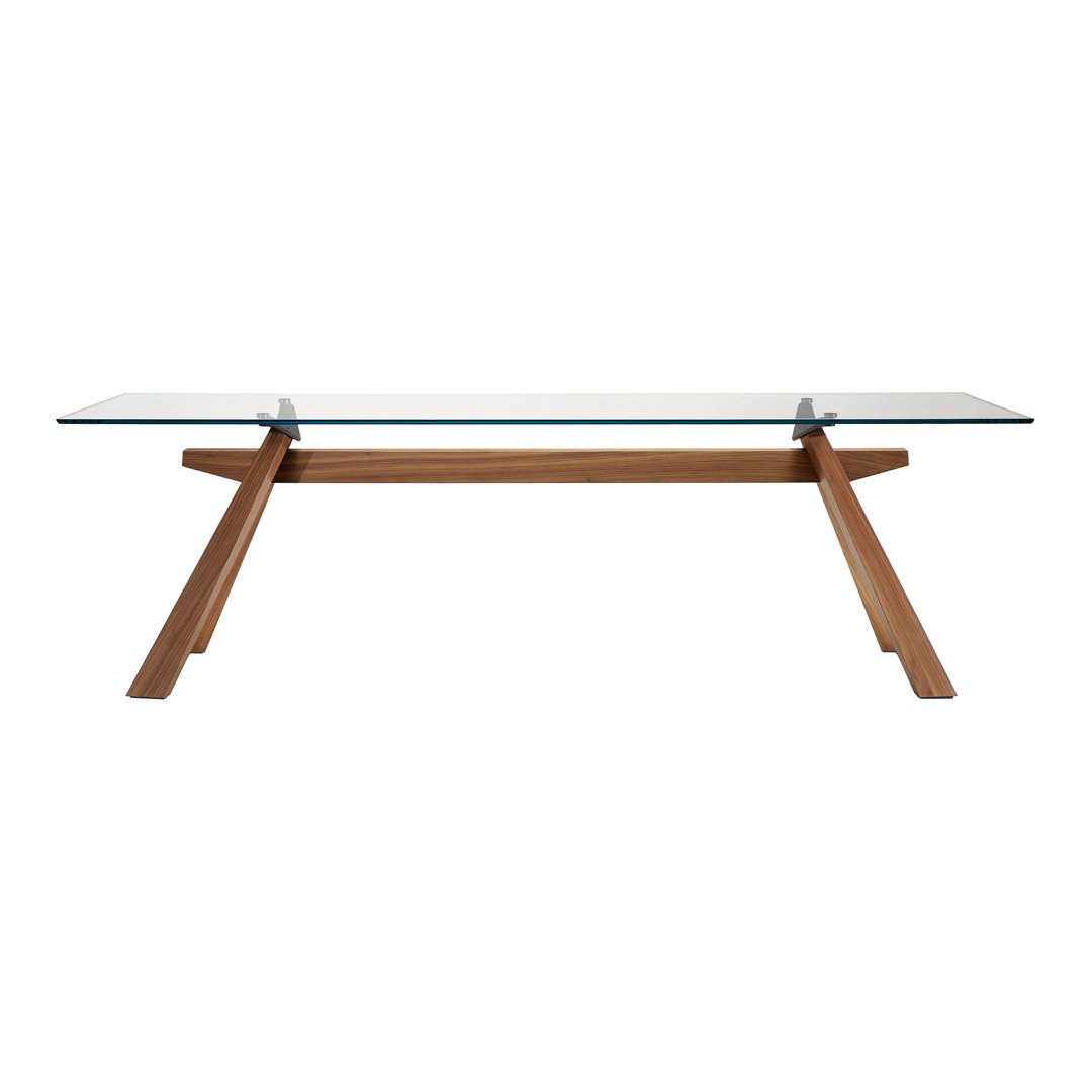 "Modern glass dining table with a sleek, transparent surface and minimalistic wooden legs featuring a warm, natural finish."