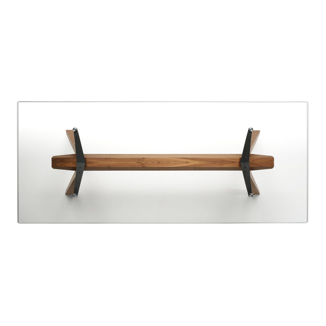 Wooden bench with a natural brown finish and sleek black metal accents against a white backdrop.
