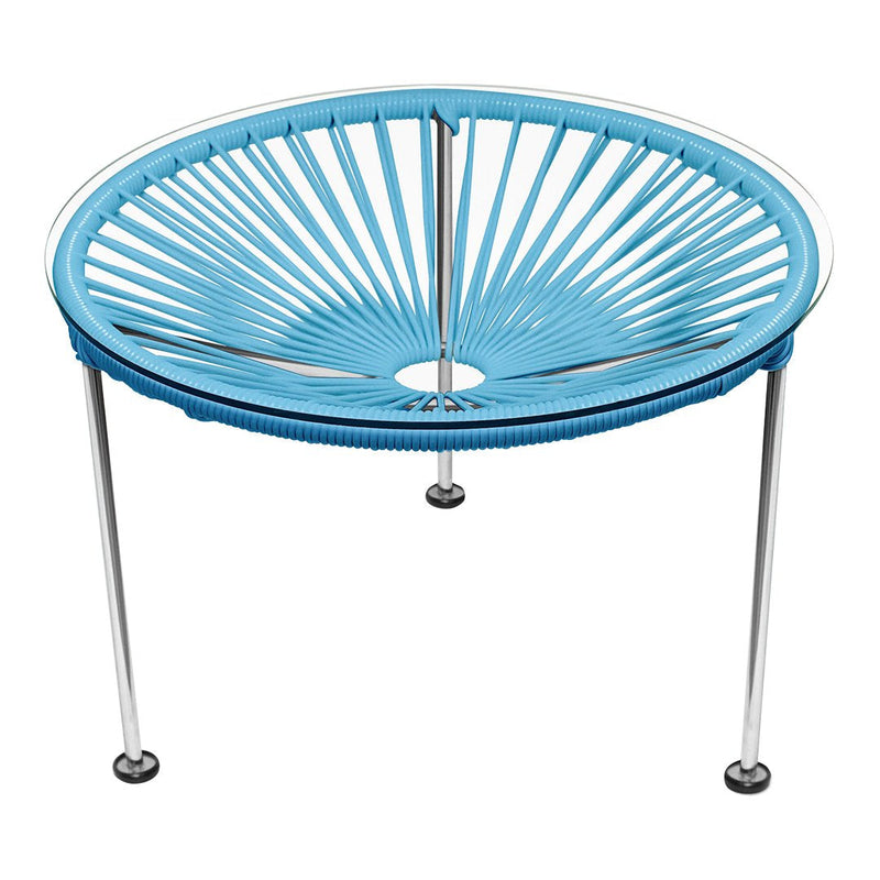 Round blue table with a sunburst pattern and chrome legs, perfect for modern decor. Suitable for indoor or outdoor use.
