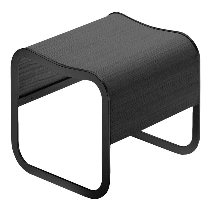 Black curved side table with a sleek, minimalist design and subtle wood grain texture. Perfect for modern decor.