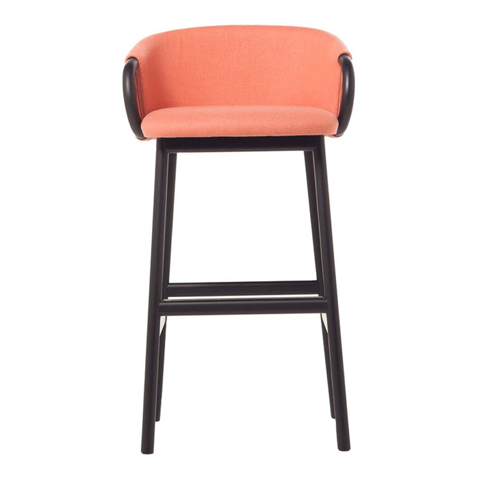Coral upholstered bar stool with sleek black frame and curved armrests, perfect for modern spaces.
