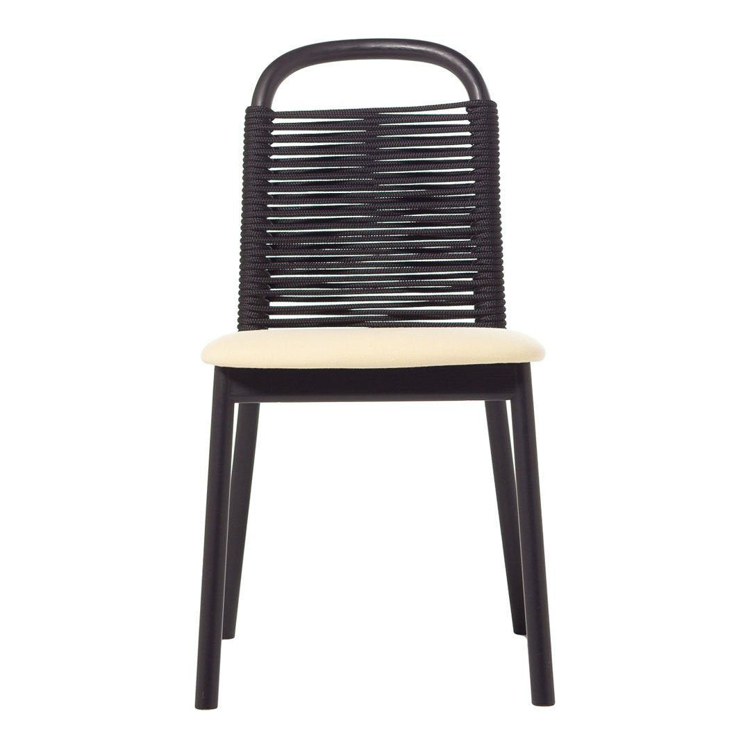 Black woven chair with a cream cushion, showcasing a modern, minimalist design in a sleek color palette.