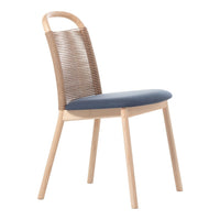 Light wood chair with a woven back and dark blue cushioned seat, featuring a modern and minimalistic design.