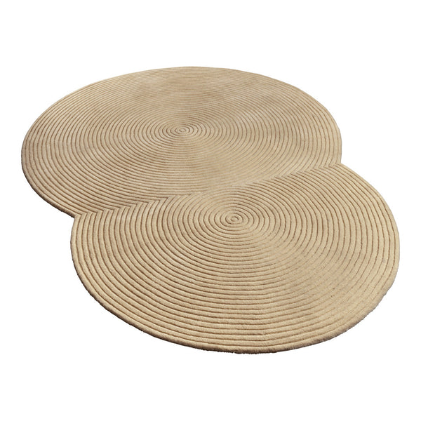 Beige circular area rug with concentric spiral patterns, adding a modern touch to any space.