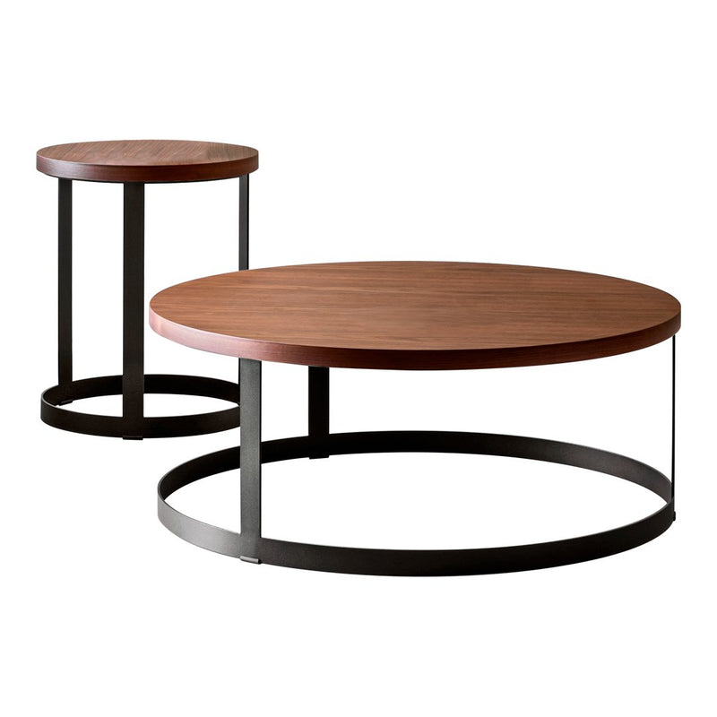 "Set of two round coffee tables with rich wood tops and sleek black metal bases."