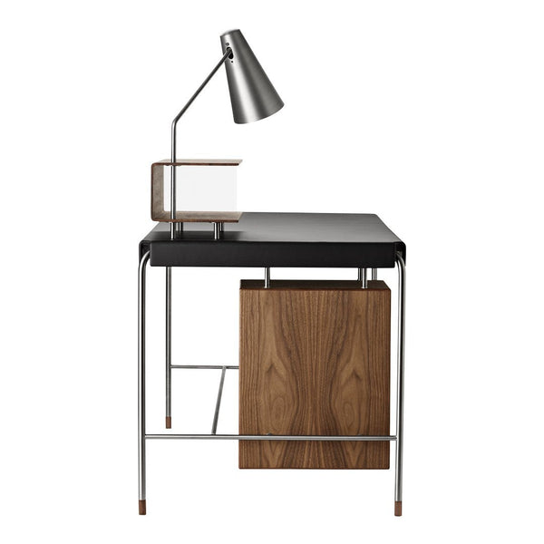Stylish desk featuring a black top and walnut drawer with chrome legs, perfect for modern spaces.