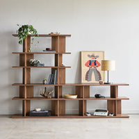 "Modern wooden bookshelf with rich brown finish, featuring clean lines and geometric layering design."