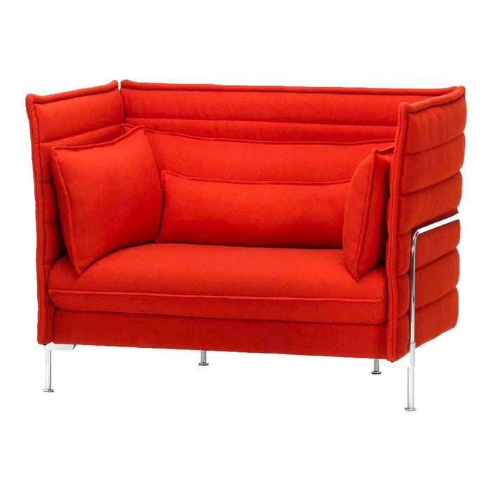 Bright red upholstered loveseat with smooth, modern lines and two matching cushions. Stylish chrome accents.