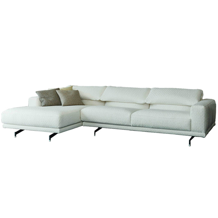 Modern white sectional sofa with sleek lines and soft, textured cushions, complemented by a neutral accent pillow.