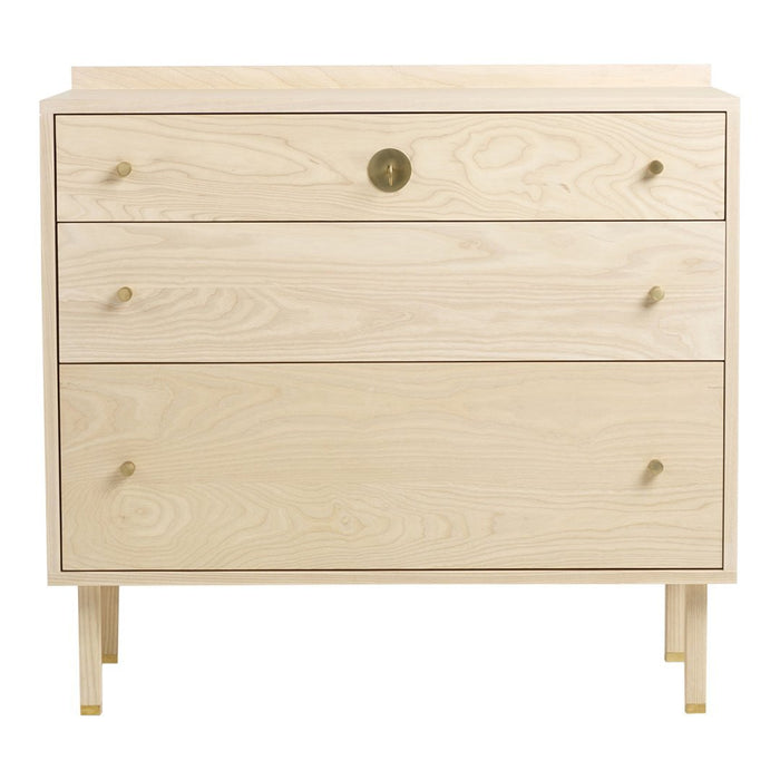Light wood dresser with natural grain, featuring three drawers and brass handles for a modern, minimalist look.