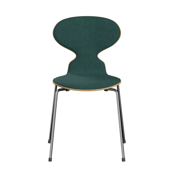 Green upholstered chair with a distinctive curved shape and wooden accents, set on sleek metal legs.