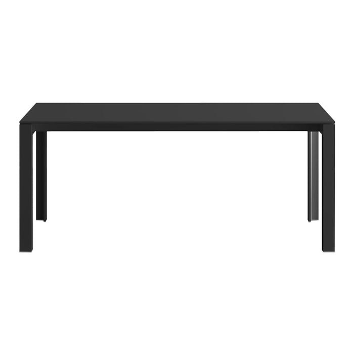 "Solid black dining table with a sleek, modern design and straight legs, perfect for minimalist interiors."