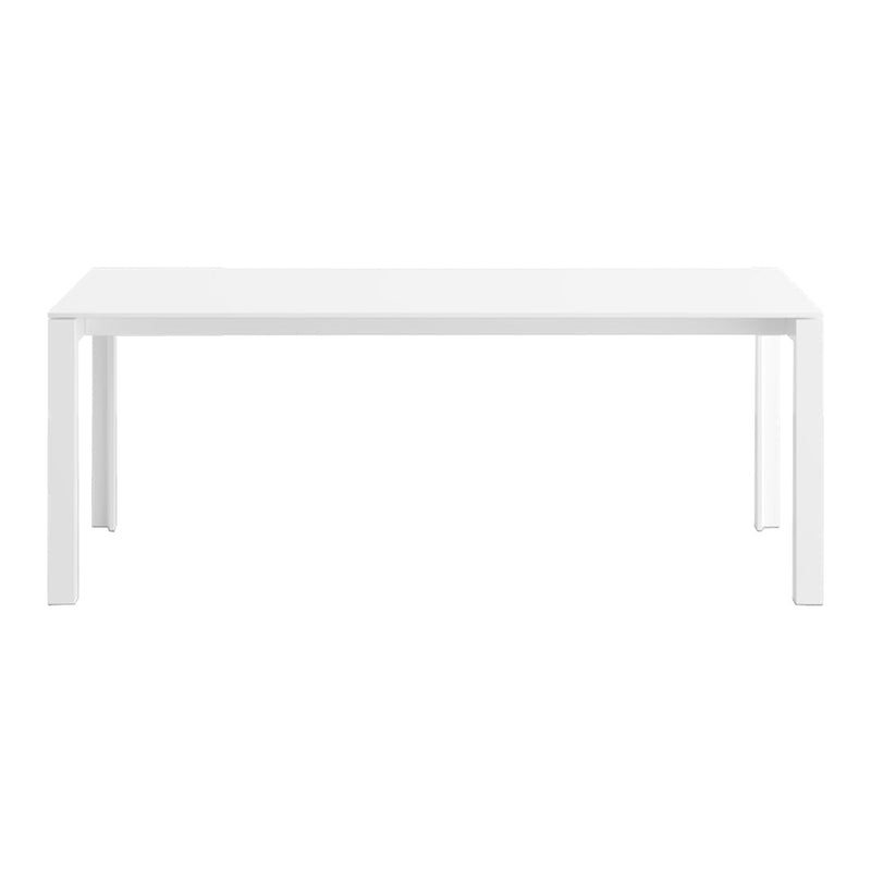 White rectangular dining table with a sleek, minimalist design and smooth, glossy finish. Perfect for modern interiors.