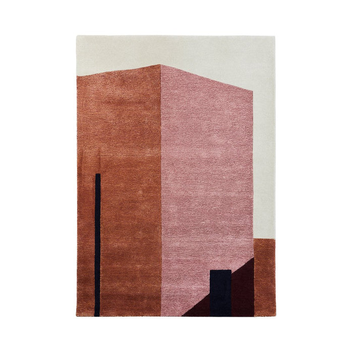 Abstract rug featuring warm pink and earthy tones with geometric patterns and contrasting dark accents.