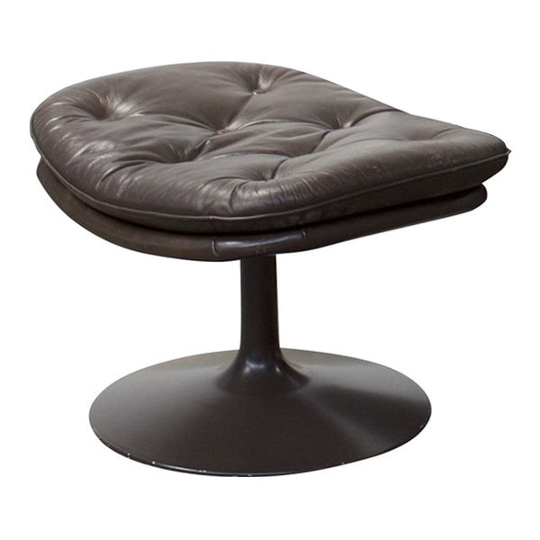 Brown leather swivel chair with tufted pattern and sleek black base, perfect for modern decor.