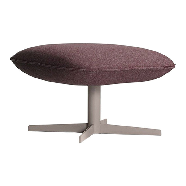 Round, burgundy upholstered ottoman with a sleek gray base and subtle textured fabric pattern.