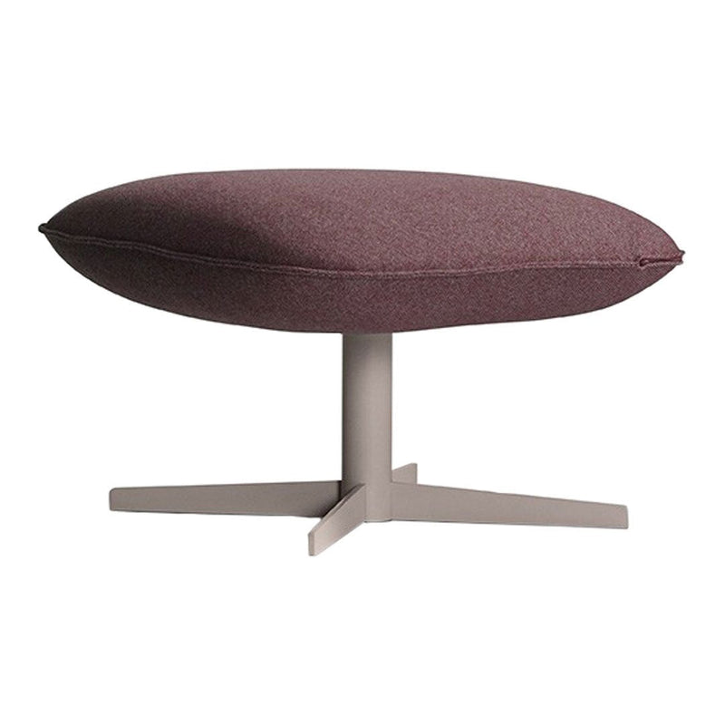 Round, burgundy upholstered ottoman with a sleek gray base and subtle textured fabric pattern.