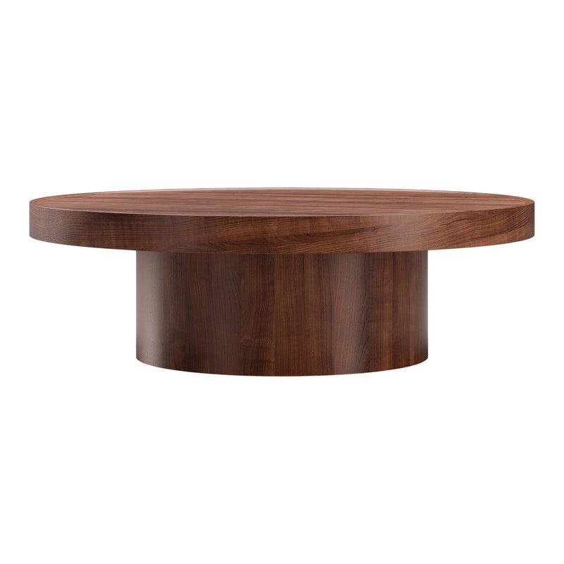 Round coffee table in rich walnut wood, featuring a smooth, seamless surface and a modern cylindrical base.