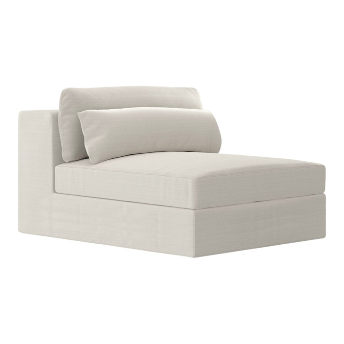 Soft beige chaise lounge with a smooth, minimalistic design and plush pillows for added comfort.