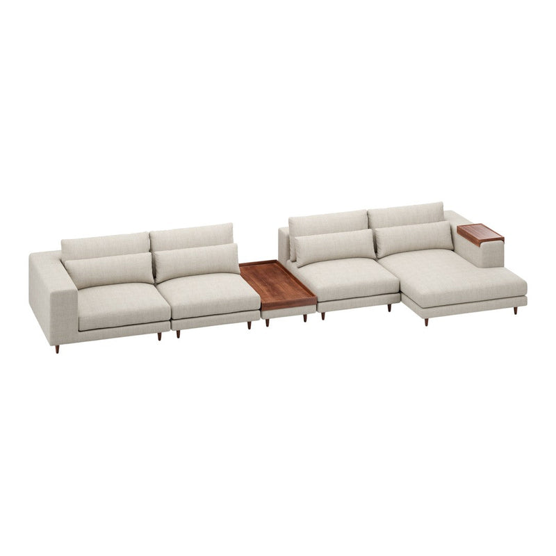 Beige sectional sofa with clean lines, soft textures, and a contrasting wooden armrest, ideal for modern living spaces.