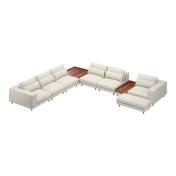 L-shaped sectional sofa in soft cream fabric with sleek lines and a wooden accent table. Modern and stylish design.