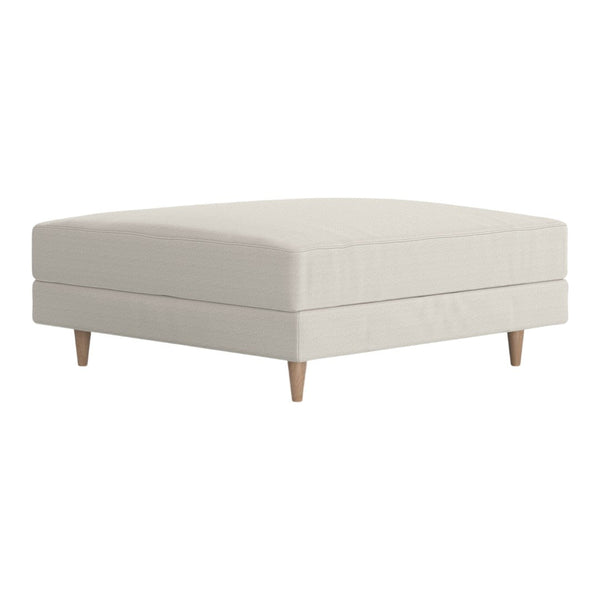 Neutral cream upholstered ottoman with smooth texture and minimalist design, featuring natural wood legs.