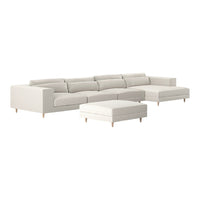 Light beige sectional sofa with minimalist design and matching ottoman, featuring muted solid color upholstery.